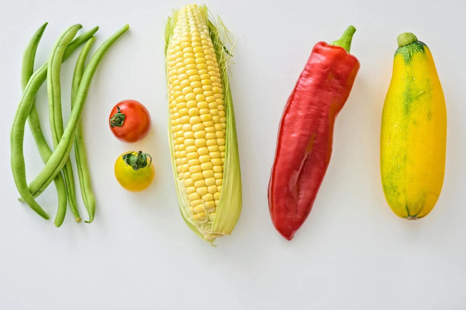 Colorful fresh vegetables and whole foods arranged on a table
